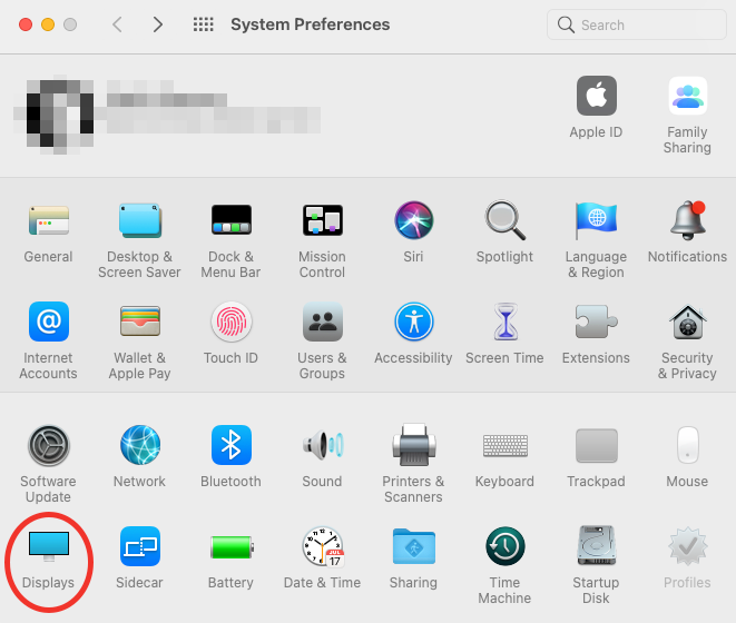The System Preferences panel of a Mac showing Displays circled in red